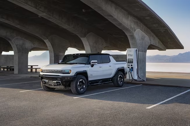 An example of the 2023 GMC HUMMER EV charging in a public space
