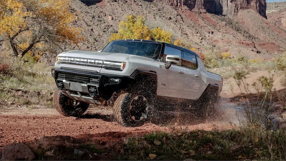 xAn example of the 2023 GMC HUMMER EV pickup with air suspension engaged for more lift